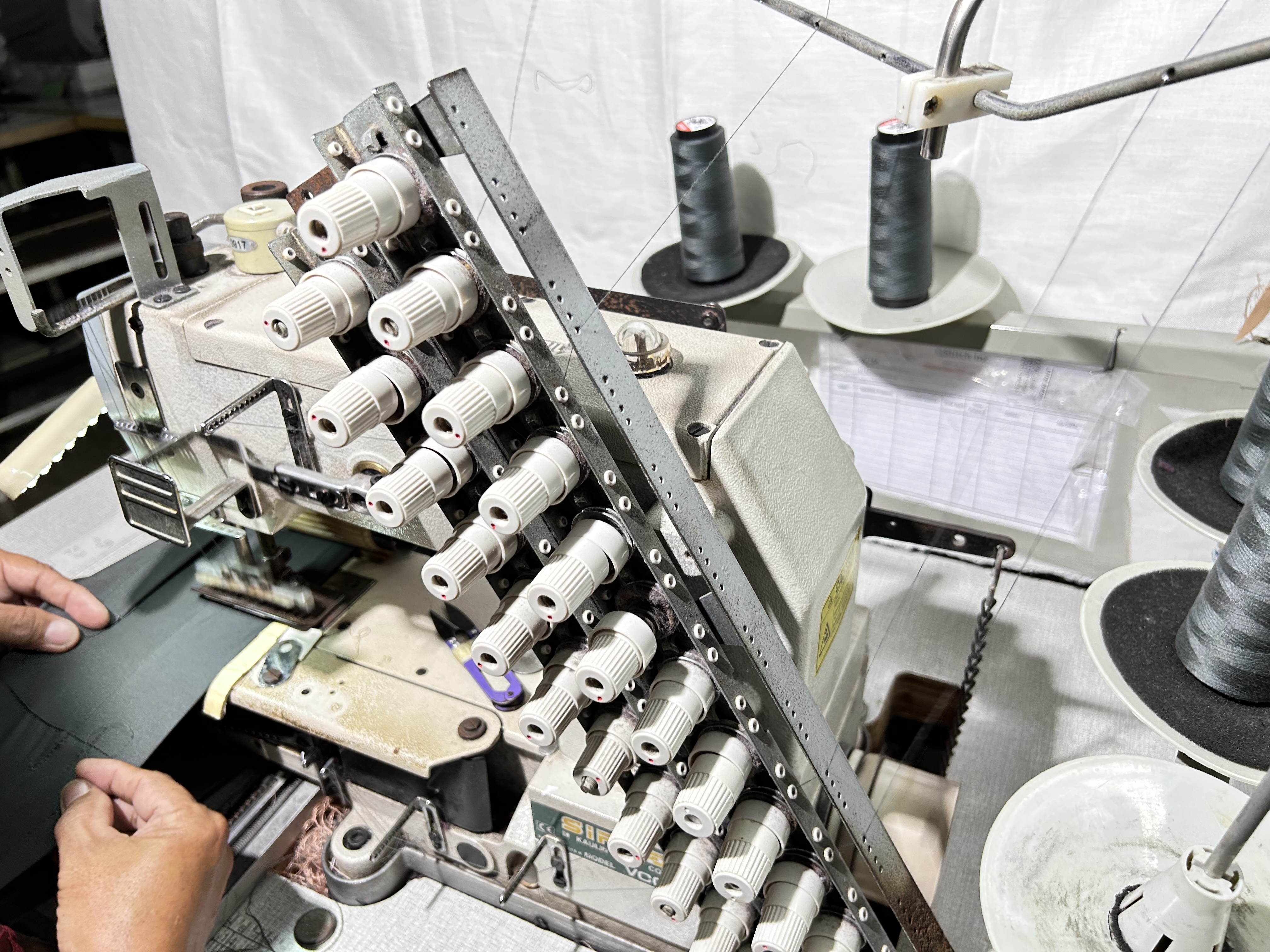 Industrial sewing machines in production line